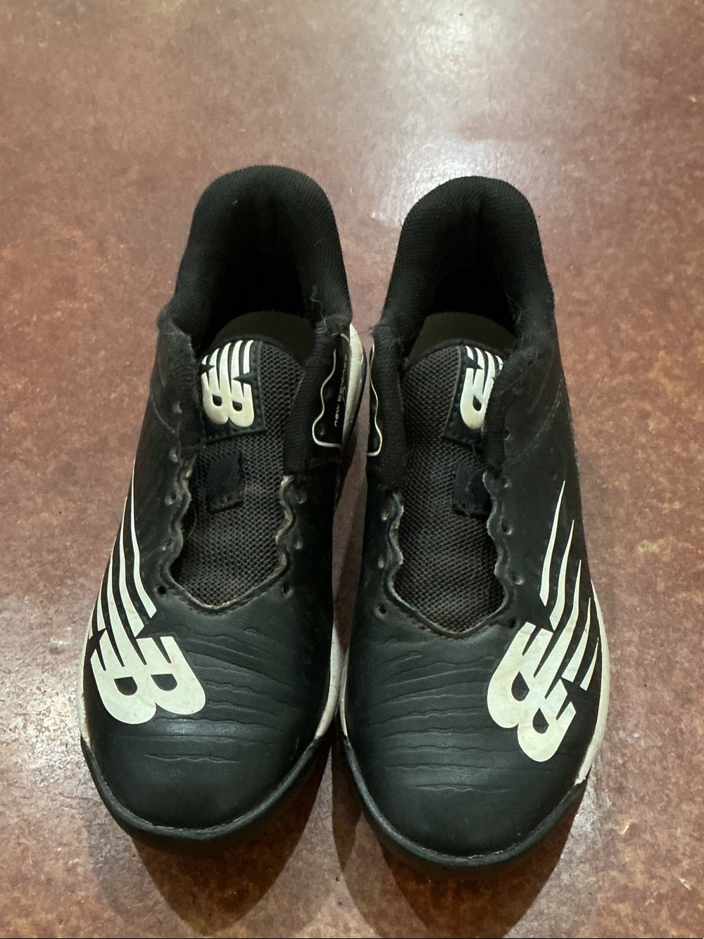 New Balance Kids Black Baseball Cleats with White Logos